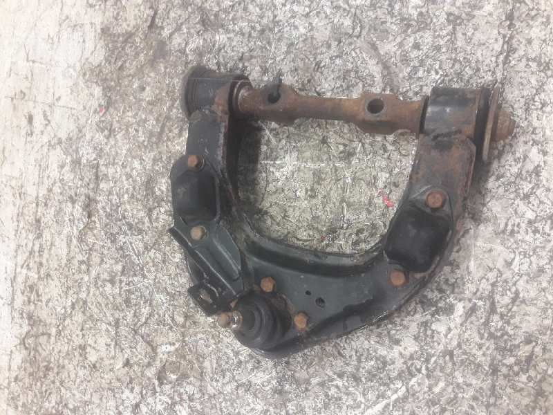Recambio de brazo suspension superior delantero izquierdo para mitsubishi l 200 (k6/7) referencia OEM IAM   